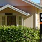 House with Sale Sign
