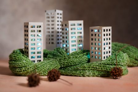 Still life of apartment buildings with knitted toys