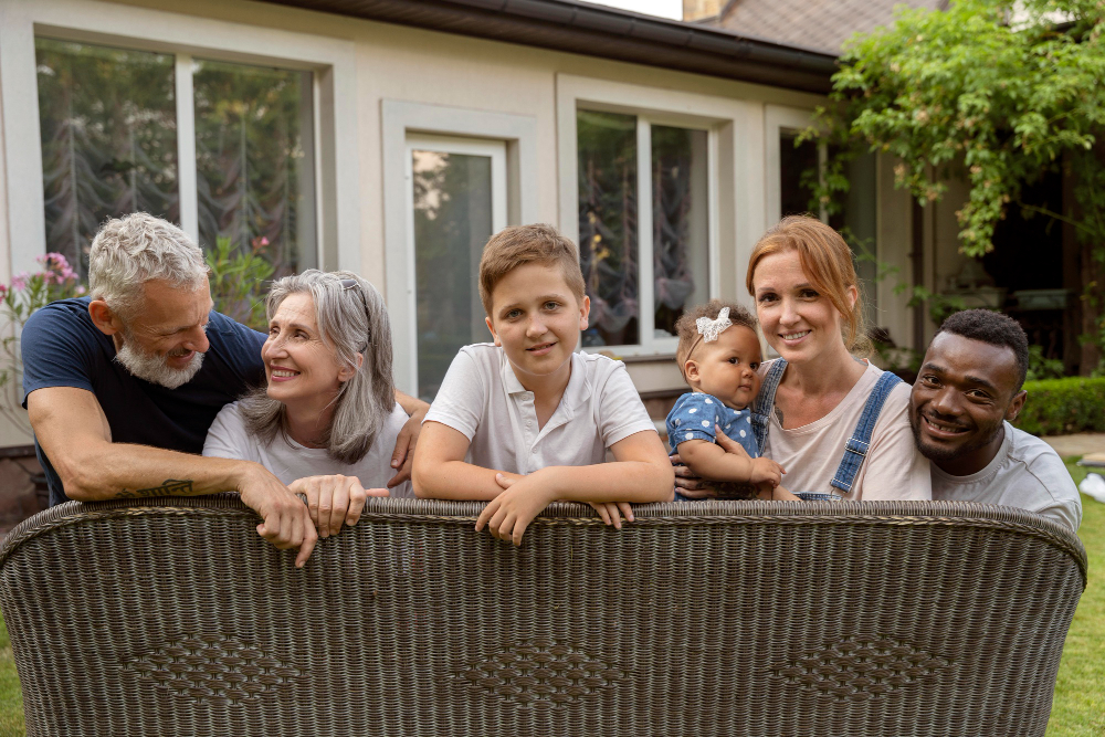 Family of different generations smiling at the camera