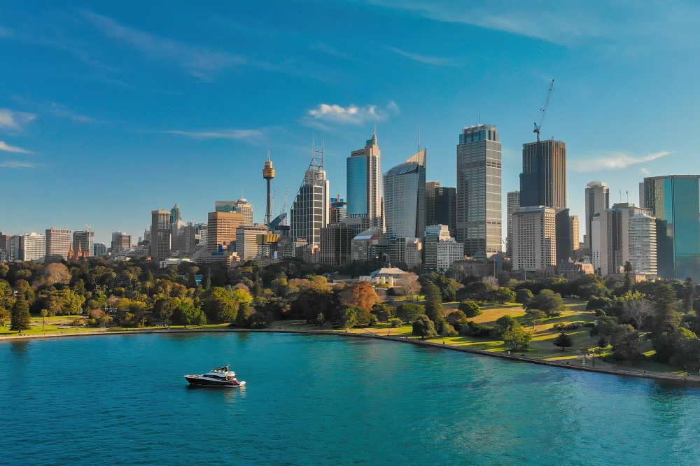Sydney city skyline against a bright blue sky